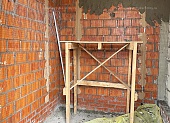 Процесс штукатурки стен в котельной